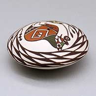 A polychrome seed pot decorated above the shoulder with a cloudeater, fish and spiral mesa geometric design, click or tap to see a larger version