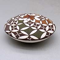 A polychrome seed pot decorated above the shoulder with a butterfly and geometric design, click or tap to see a larger version
