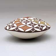 A polychrome seed pot decorated above the shoulder with a butterfly and geometric design, click or tap to see a larger version