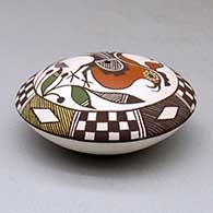 A polychrome seed pot decorated above the shoulder with a parrot, plant, checkerboard, fineline and geometric design, click or tap to see a larger version