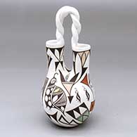 A polychrome wedding vase with a twisted handle and decorated with a parrot, quail and geometric design
 by Judy Lewis of Acoma