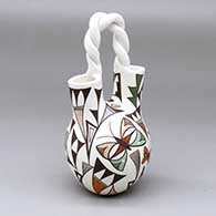 A polychrome wedding vase with a twisted handle and decorated with a kokopelli, butterfly and geometric design
 by Judy Lewis of Acoma