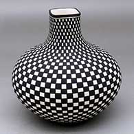 A black-on-white jar with an extended squarish neck and a checkerboard geometric design
 by Paula Estevan of Acoma