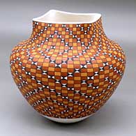 A polychrome jar with a squarish rim and decorated with a checkerboard and geometric design
 by Frederica Antonio of Acoma