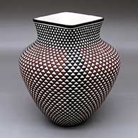 A polychrome jar with a square opening and a spiral mesa geometric design
 by Paula Estevan of Acoma