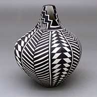 A black on white tear drop jar with a kiva step cut opening and decorated with a geometric design
 by Sandra Victorino of Acoma