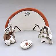 A four-piece polychrome Nativity set
 by Judy Lewis of Acoma