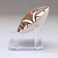 A miniature polychrome seed pot decorated with a four-panel fish and geometric design above the shoulder, click or tap to see a larger version