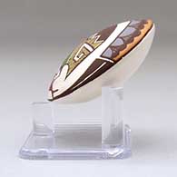 A miniature polychrome seed pot decorated with a cloudeater, fish and geometric design above the shoulder, click or tap to see a larger version