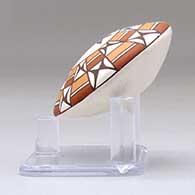 A miniature polychrome seed pot decorated with a dragonfly and geometric design above the shoulder, click or tap to see a larger version
