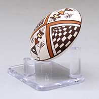 A miniature polychrome seed pot decorated with a pueblo dancer, checkerboard and geometric design above the shoulder, click or tap to see a larger version