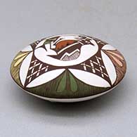 A polychrome seed pot decorated above the shoulder with a cloudeater, fish, fineline and geometric design, click or tap to see a larger version