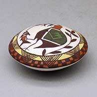 A polychrome seed pot decorated above the shoulder with a cloudeater, fish, fineline and geometric design, click or tap to see a larger version
