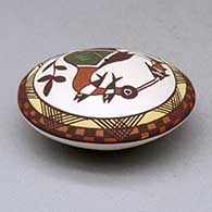 A polychrome seed pot decorated above the shoulder with a cloudeater, fish, fineline and geometric design, click or tap to see a larger version