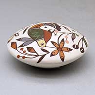 A polychrome seed pot decorated above the shoulder with a hummingbird, dragonfly, flower and geometric design, click or tap to see a larger version