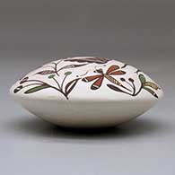 A polychrome seed pot decorated above the shoulder with a hummingbird, dragonfly, flower and geometric design, click or tap to see a larger version
