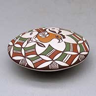 A polychrome seed pot decorated above the shoulder with a parrot, branch and geometric design, click or tap to see a larger version