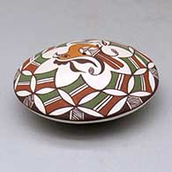 A polychrome seed pot decorated above the shoulder with a parrot, branch and geometric design, click or tap to see a larger version