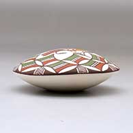 A polychrome seed pot decorated above the shoulder with a parrot, branch and geometric design, click or tap to see a larger version