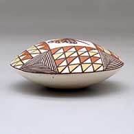 A polychrome seed pot decorated above the shoulder with a butterfly and geometric design, click or tap to see a larger version