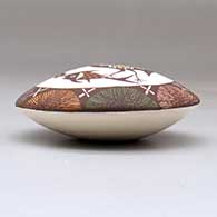 A polychrome seed pot decorated above the shoulder with a cloudeater, fish, fineline and geometric design, click or tap to see a larger version