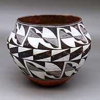 A polychrome jar decorated with a three-band, seven-panel geometric design
 by Unknown of Acoma