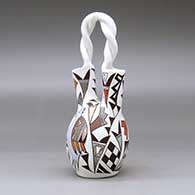 A polychrome wedding vase with a twisted handle and decorated with a kokopelli, bird and geometric design, click or tap to see a larger version