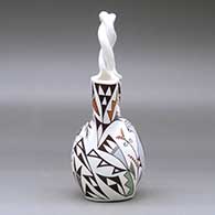 A polychrome wedding vase with a twisted handle and decorated with a kokopelli, bird and geometric design, click or tap to see a larger version