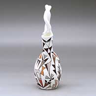 A polychrome wedding vase with a twisted handle and decorated with a butterfly, corn plant, thunderbird and geometric design, click or tap to see a larger version