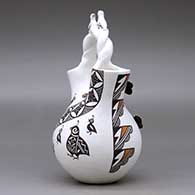 A polychrome wedding vase with a twisted bridge and decorated with lady bug, bird and butterfly appliques and painted with a corn stalk, butterfly, quail and geometric design, click or tap to see a larger version