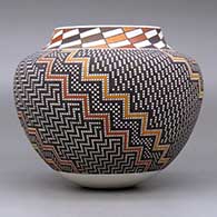 A polychrome jar with a raised rim and decorated with a tiny square and geometric design, click or tap to see a larger version