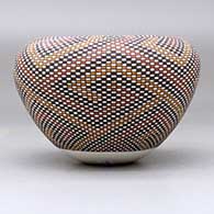 A polychrome jar with an Infinity rim and decorated with a tiny checkerboard-pattern geometric design, click or tap to see a larger version