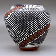 A polychrome jar decorated with a two-panel spiraling checkerboard, fineline, feather and geometric design, click or tap to see a larger version