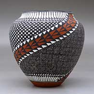 A polychrome jar decorated with a two-panel spiraling checkerboard, fineline, feather and geometric design, click or tap to see a larger version