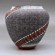 A polychrome jar decorated with a two-panel spiraling checkerboard, fineline, feather and geometric design, click or tap to see a larger version