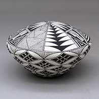 A black on white seed pot decorated with a yucca-leaf snowflake, fineline and geometric design, click or tap to see a larger version