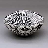 A black on white seed pot decorated with a yucca-leaf snowflake, fineline and geometric design, click or tap to see a larger version