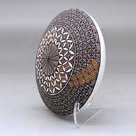 A black on white seed pot decorated above the shoulder with a fineline and geometric design, click or tap to see a larger version