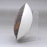 A black on white seed pot decorated above the shoulder with a fineline and geometric design, click or tap to see a larger version
