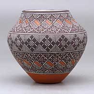 A polychrome jar decorated with a fineline and geometric design, click or tap to see a larger version