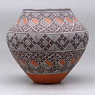 A polychrome jar decorated with a fineline and geometric design, click or tap to see a larger version