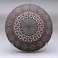 Click for a larger view A polychrome seed pot decorated above the shoulder with a North Star fineline and geometric design
by Rebecca Lucario of Acoma