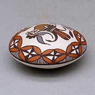 A miniature polychrome seed pot decorated with a parrot, branch, fineline and geometric design above the shoulder, click or tap to see a larger version