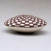 A miniature polychrome seed pot decorated with a dragonfly and checkerboard geometric design above the shoulder, click or tap to see a larger version