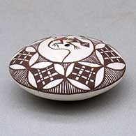 A miniature polychrome seed pot decorated with a lizard, fineline and geometric design above the shoulder, click or tap to see a larger version