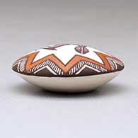 A miniature polychrome seed pot decorated with a Mimbres rabbit, fineline and geometric design above the shoulder, click or tap to see a larger version