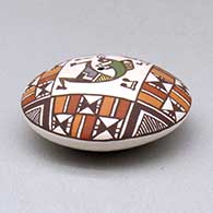 A miniature polychrome seed pot decorated with a kokopelli and geometric design above the shoulder, click or tap to see a larger version