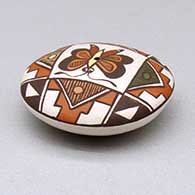 A miniature polychrome seed pot decorated with a butterfly, fineline and geometric design above the shoulder, click or tap to see a larger version
