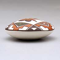 A miniature polychrome seed pot decorated with a butterfly, fineline and geometric design above the shoulder, click or tap to see a larger version