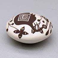 A miniature black on white seed pot decorated with a cloudeater, fish, vine and geometric design above the shoulder, click or tap to see a larger version